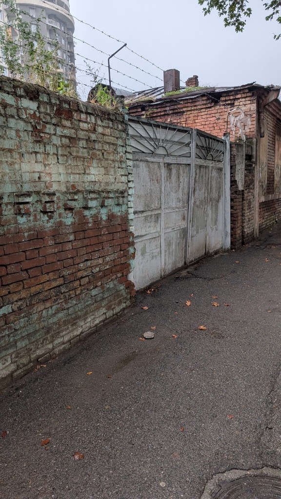 Tbilisi Neighborhood Fabric: Crumbling brickwork and corrugated tin repairs